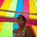 Games commissioner Elanie Oglesby smokes a cigarette while assembling a game tent on Tuesday, June 25. Daniel Brenner I AnnArbor.com